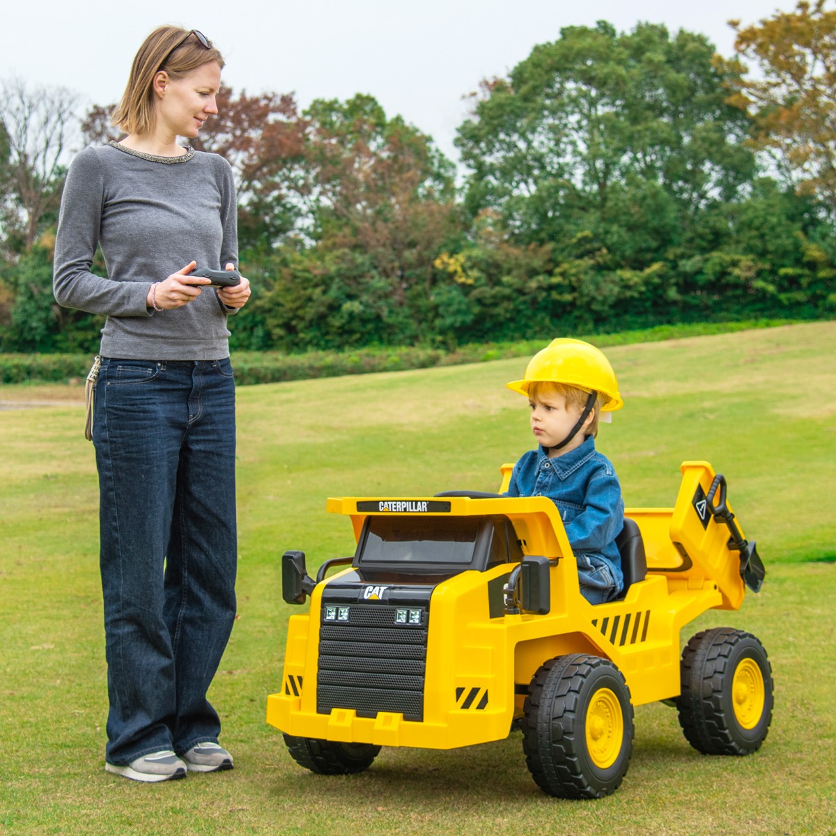 Kinder Caterpillar Elektroauto 12V Muldenkipper zum Draufsitzen mit Sandschaufel & Kippbett & Megafon